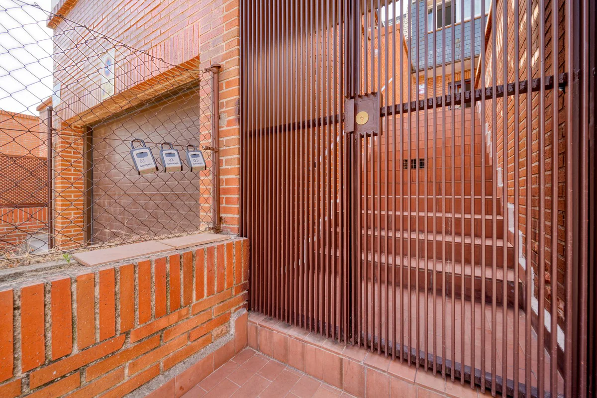 Sliding gate with a sheet panel