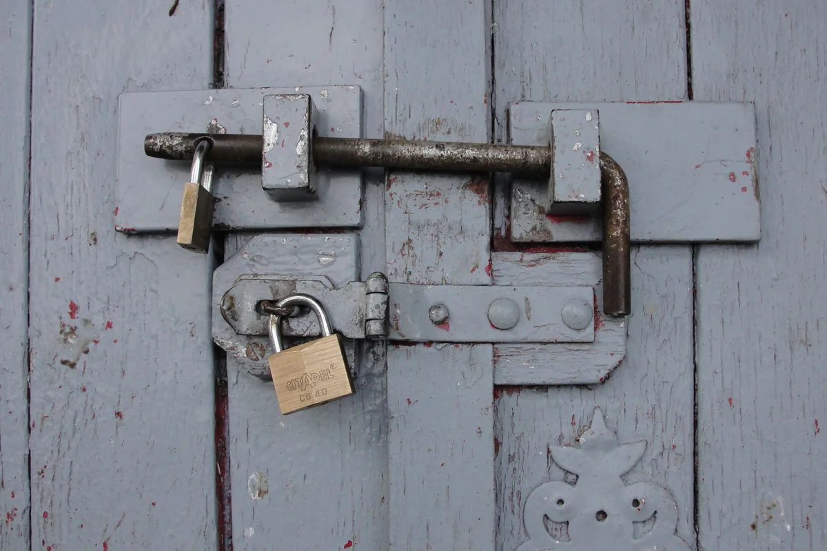 Padlock hasp with staple