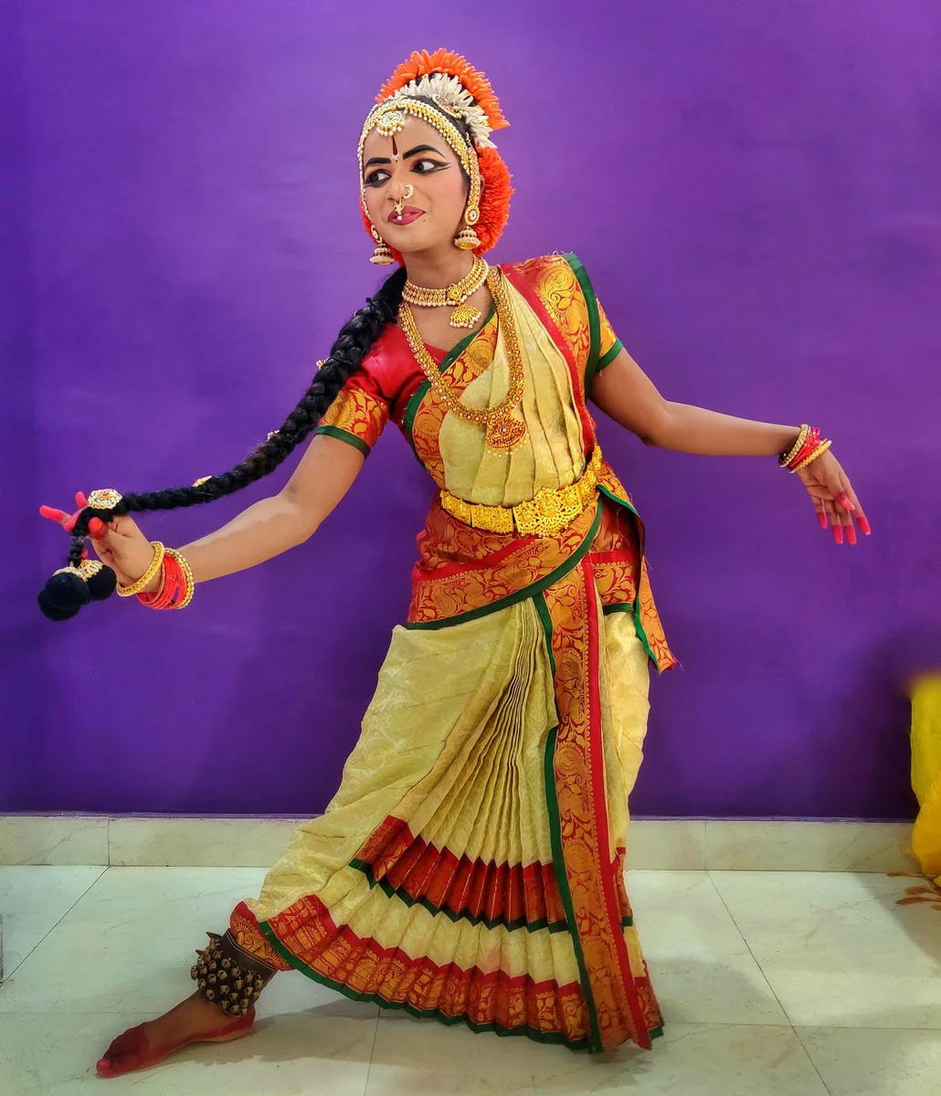 A classical dancer mid-step