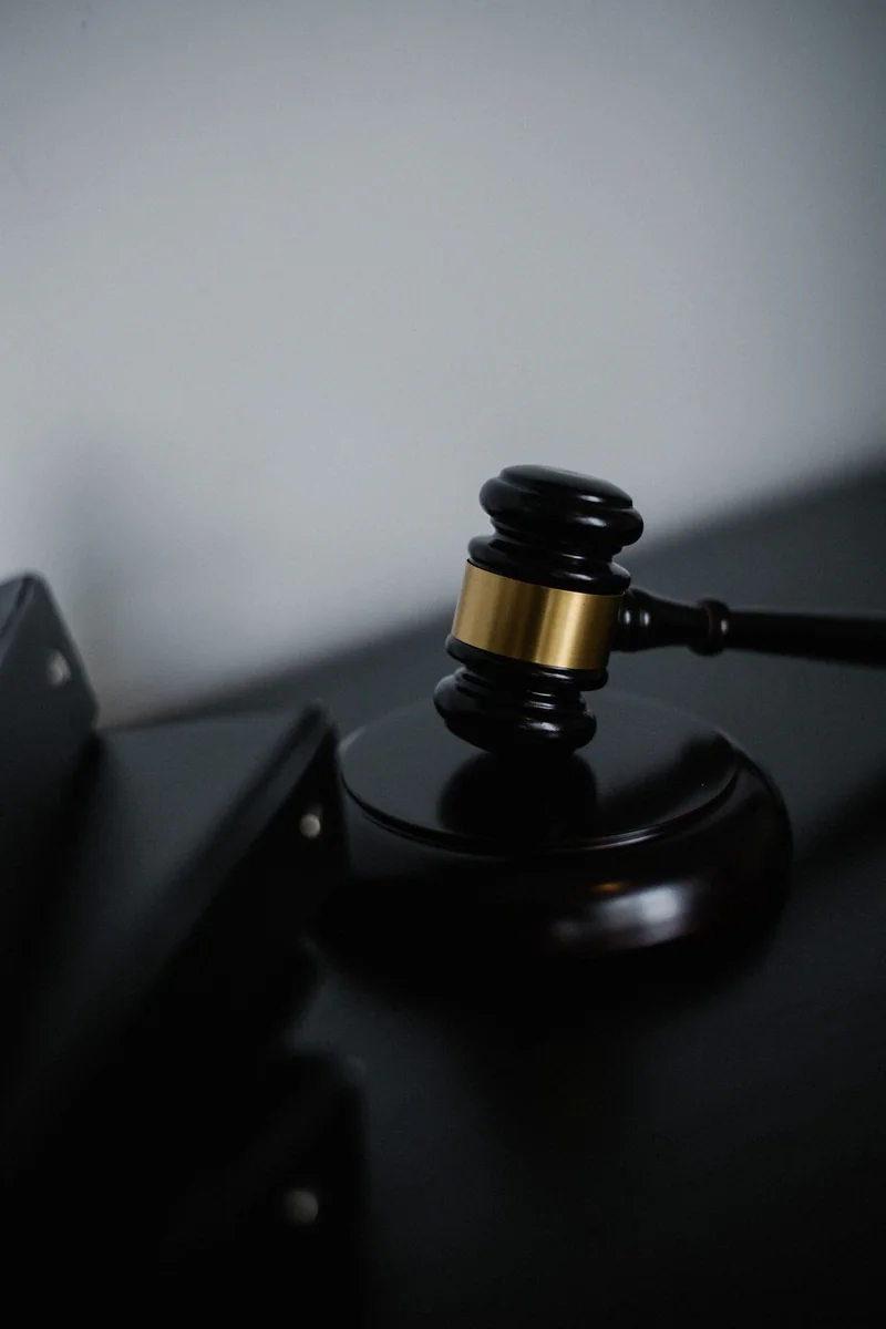 A gavel beside case files