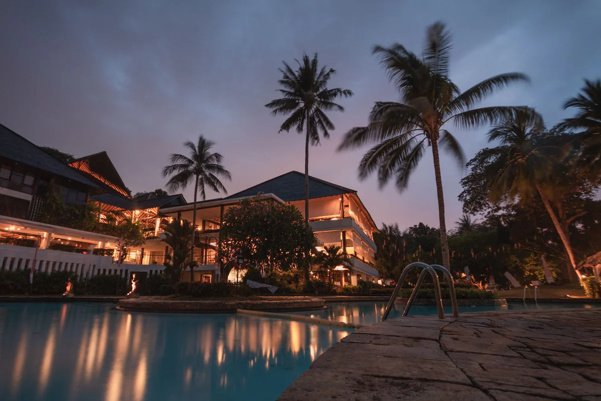 A resort pool at dusk