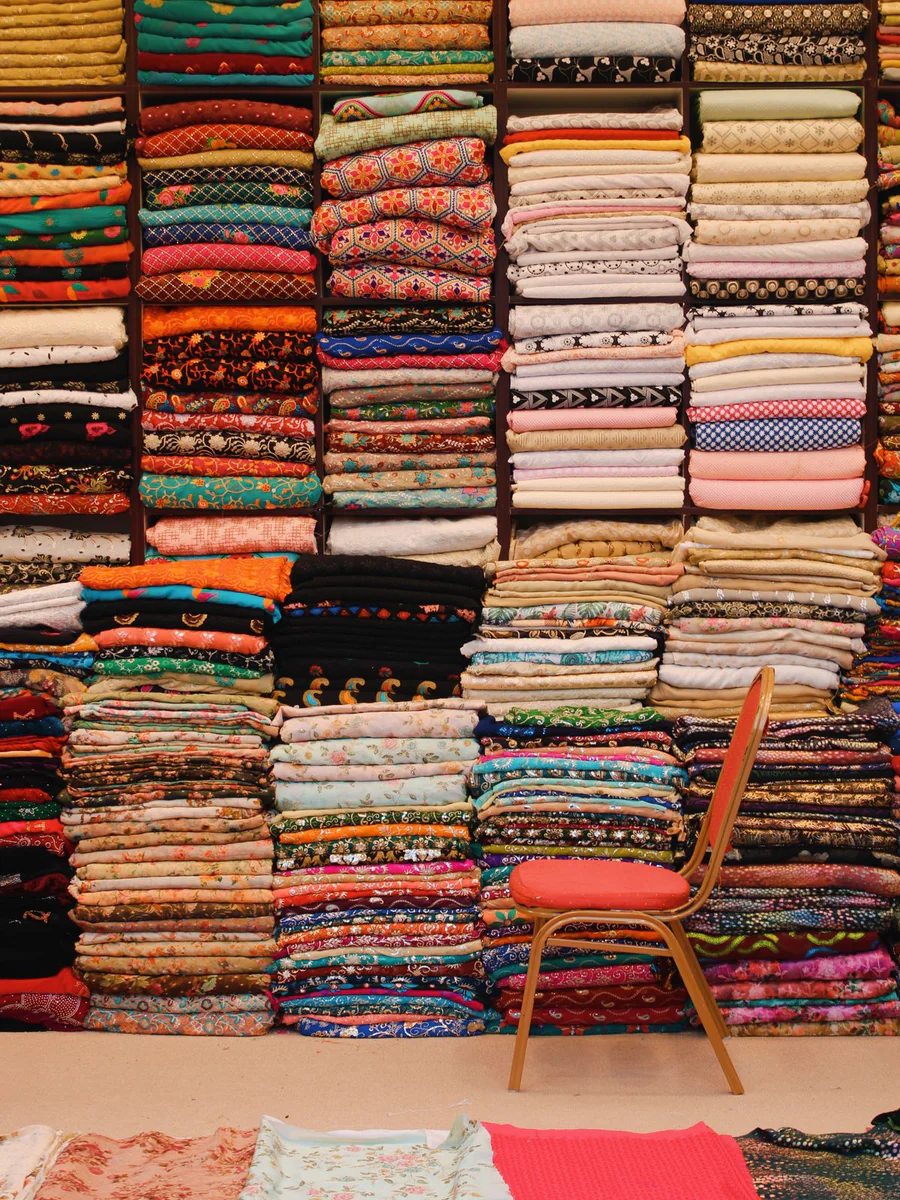 Stacks of folded sarees