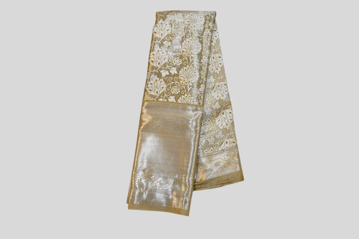 Luxurious Gold Kanchipuram Silk Saree with All-Over Zari Weaving.