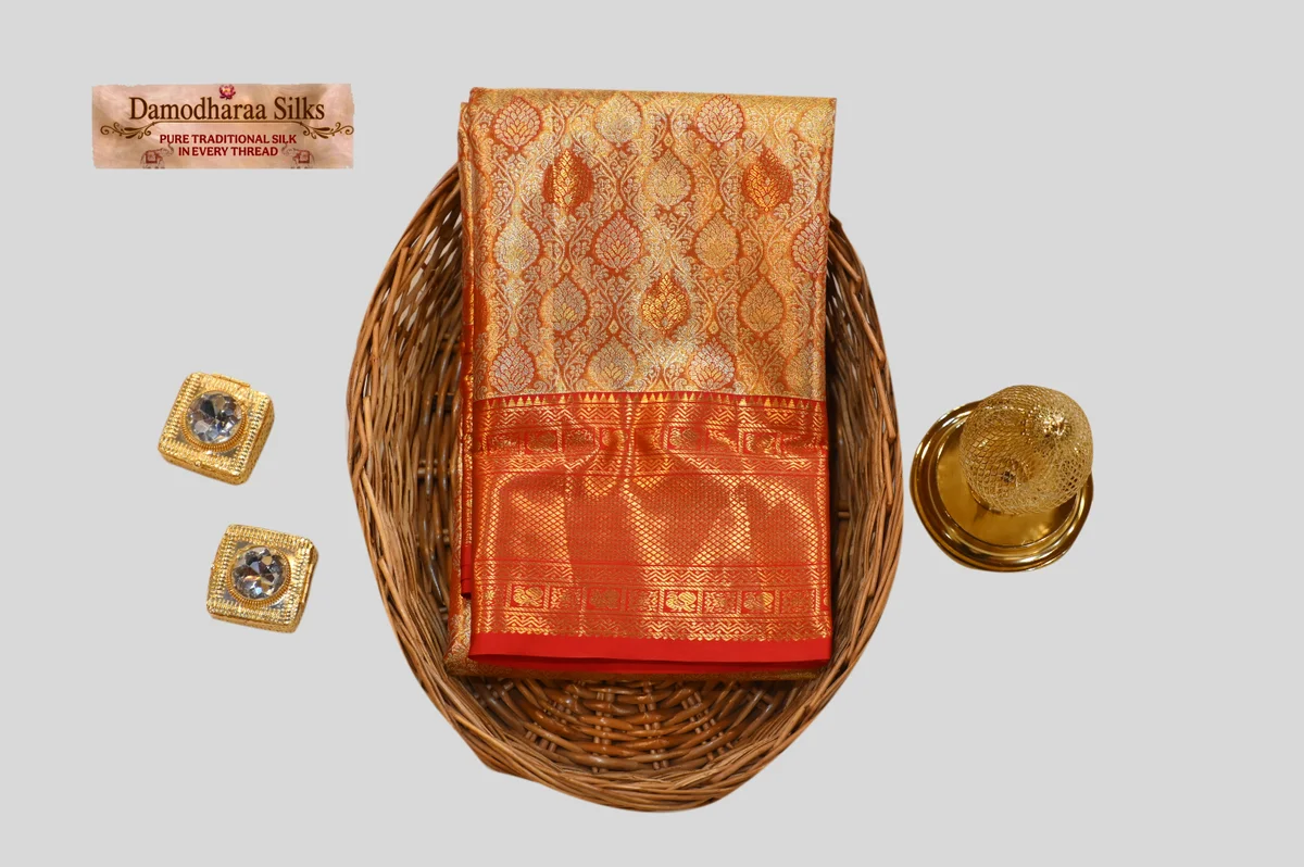 Regal Gold & Vermilion Red Kanchipuram Silk Saree with Intricate Zari Motifs