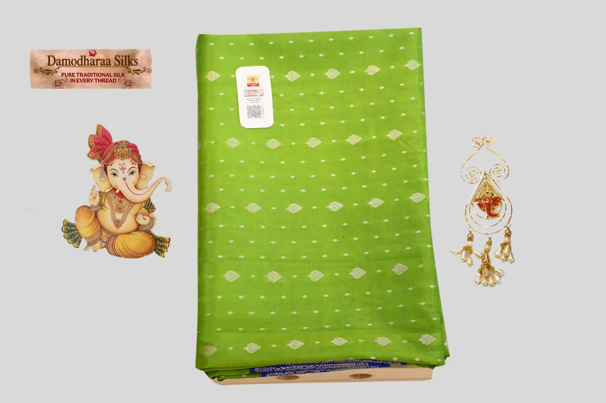 Elegant Parrot Green Silk Saree with Silver Zari Motifs