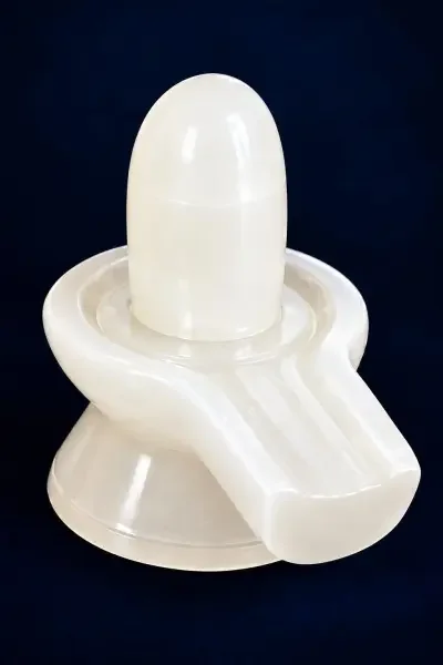 Sphatik Shivling shown from an angled view, highlighting its polished Lingam and Vedi base.