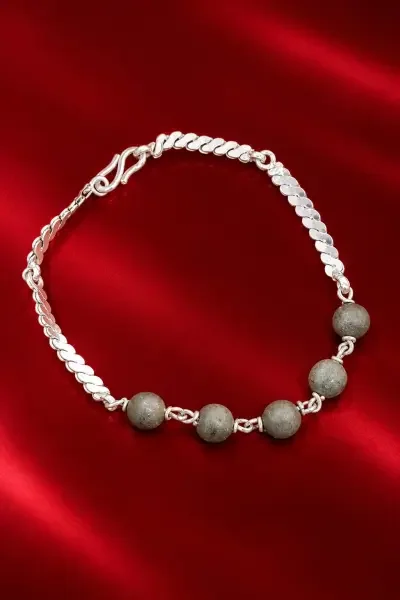 Navapashanam 5 Beads Bracelet with a polished silver chain, displayed on a premium red background.