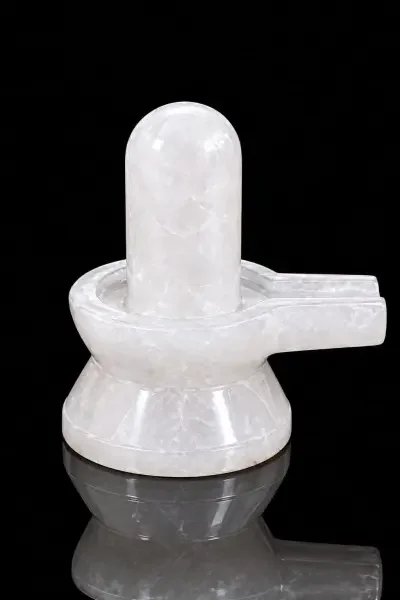 Original Sphatik Shivling displayed against a black background, highlighting its smooth white crystal form.
