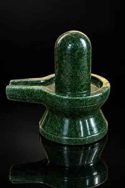 Polished Green Aventurine Shivling displayed against a black background, highlighting its rich green colour and natural mineral patterns.