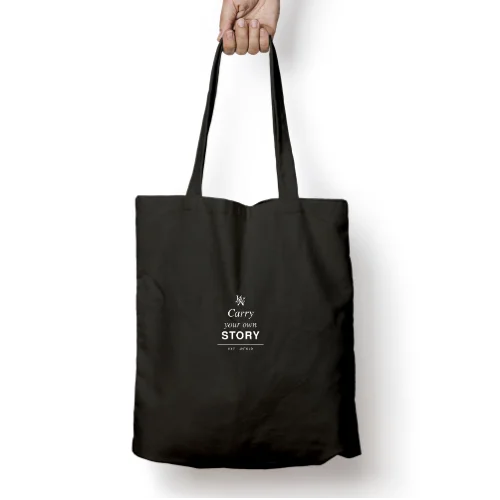 GetPrintX black cotton canvas zipper tote mockup, with Carry your own story in white and a small K&Y monogram.