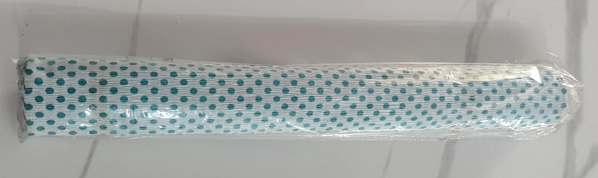 Blue and white polka dot net roll