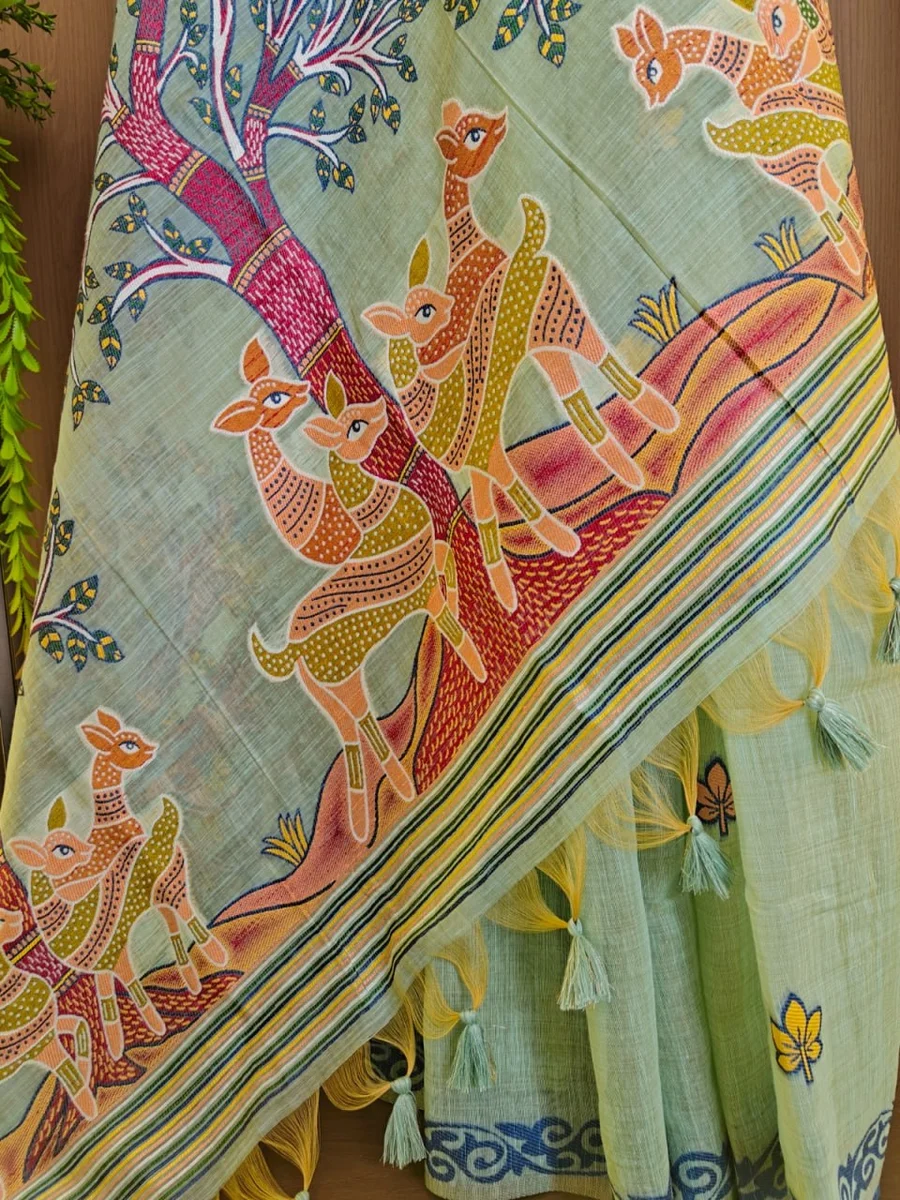 Premium Soft Muga Cotton Saree with Hiran & Tree woven pallu, all-over floral weaving, contrast border, fancy tassels + running blouse piece