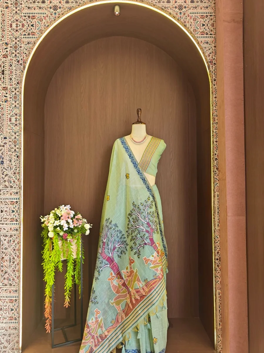 Premium Soft Muga Cotton Saree with Hiran & Tree woven pallu, all-over floral weaving, contrast border, fancy tassels + running blouse piece
