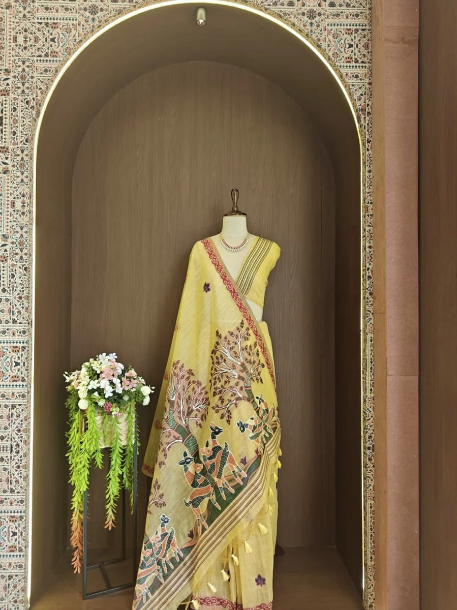 Premium Soft Muga Cotton Saree with Hiran & Tree woven pallu, all-over floral weaving, contrast border, fancy tassels + running blouse piece