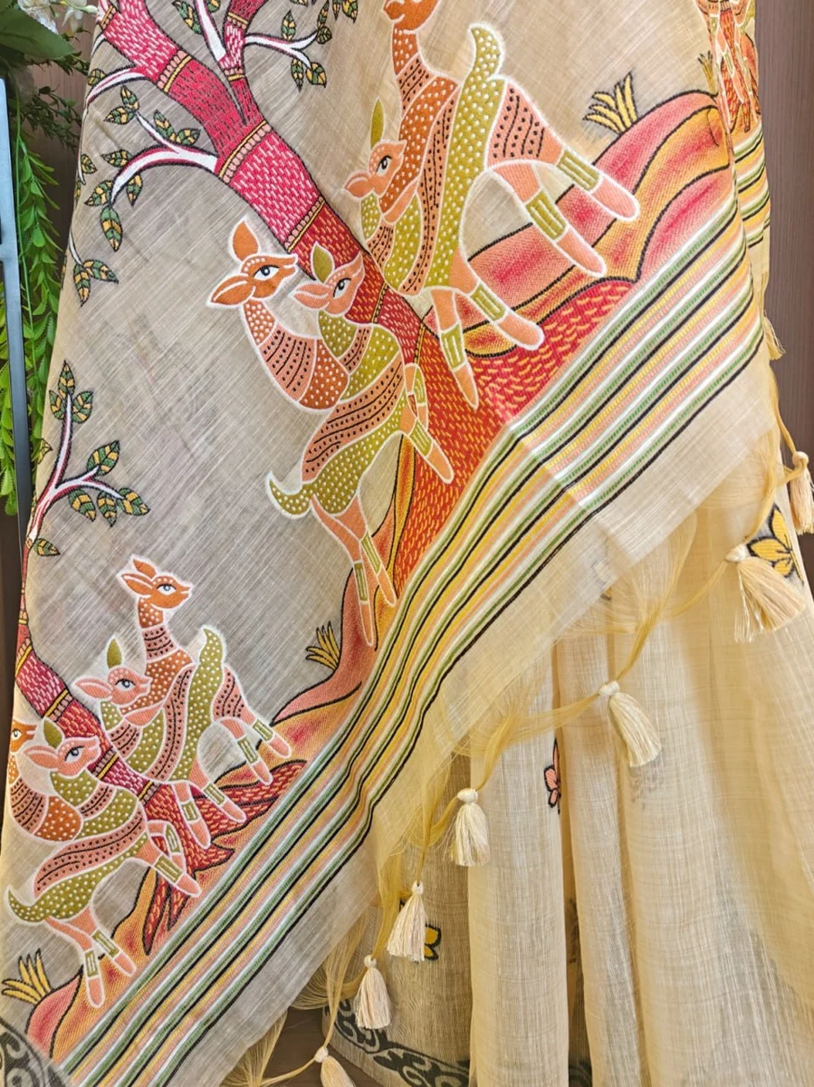 Premium Soft Muga Cotton Saree with Hiran & Tree woven pallu, all-over floral weaving, contrast border, fancy tassels + running blouse piece