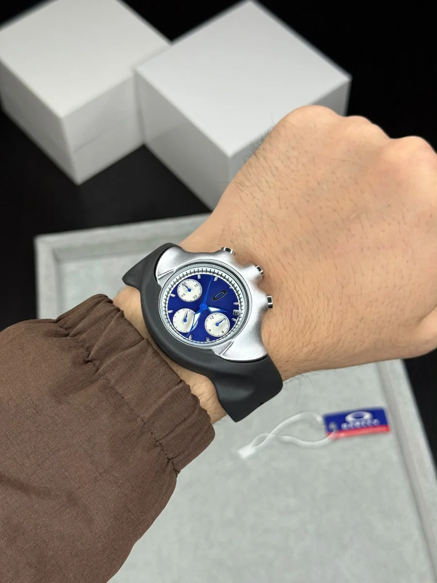 Oakley Detonator wristwatch featuring a silver bezel and black rubber strap.