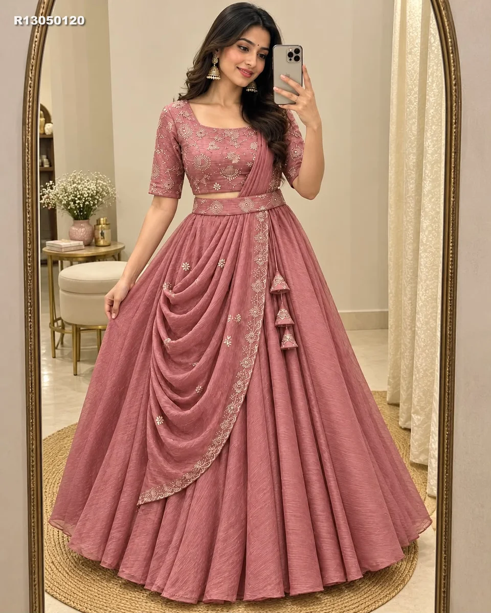 Rk ethinics.. Draped in dusty rose, this lehenga radiates refined glamour. Shimmering beadwork adds graceful sparkle to every movement. Flowing volume creates a regal 4