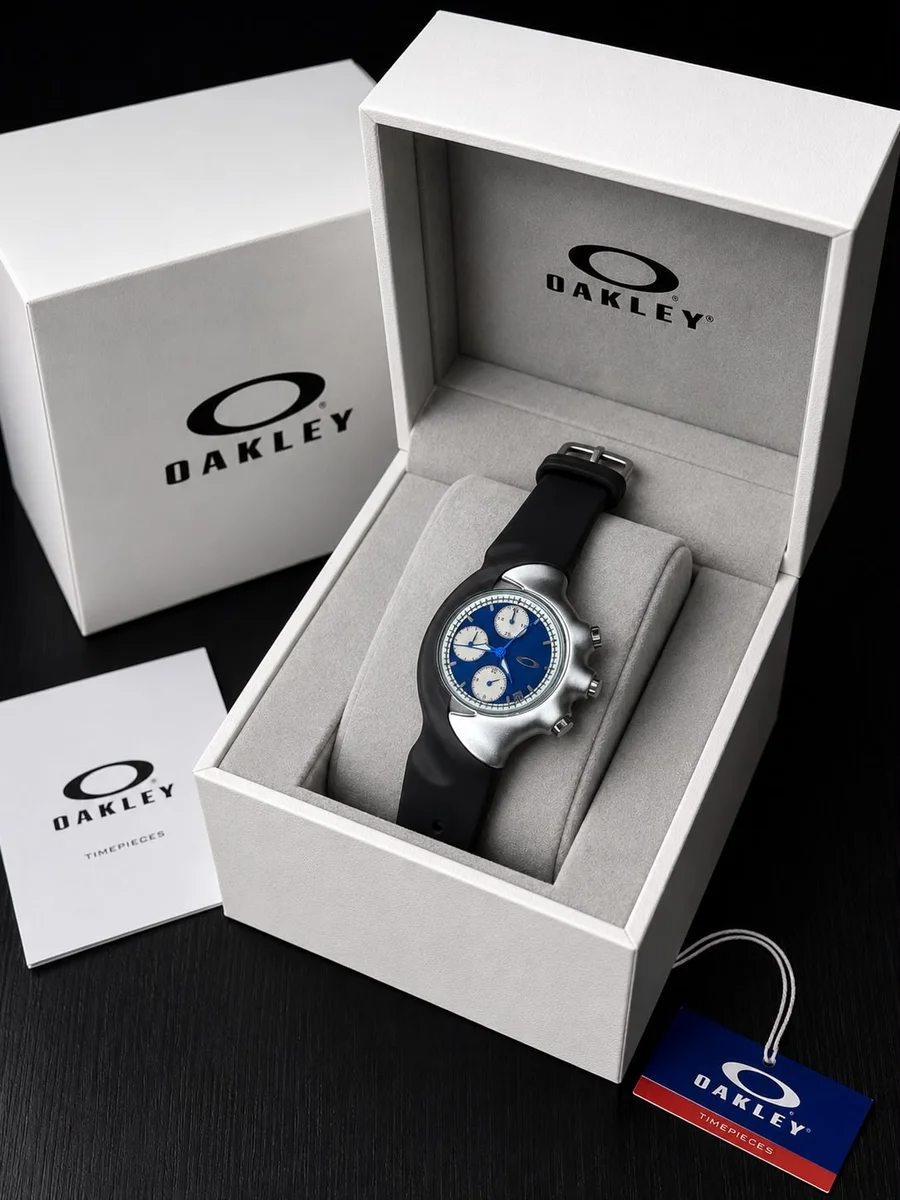 Oakley Detonator wristwatch featuring a silver bezel and black rubber strap. 3