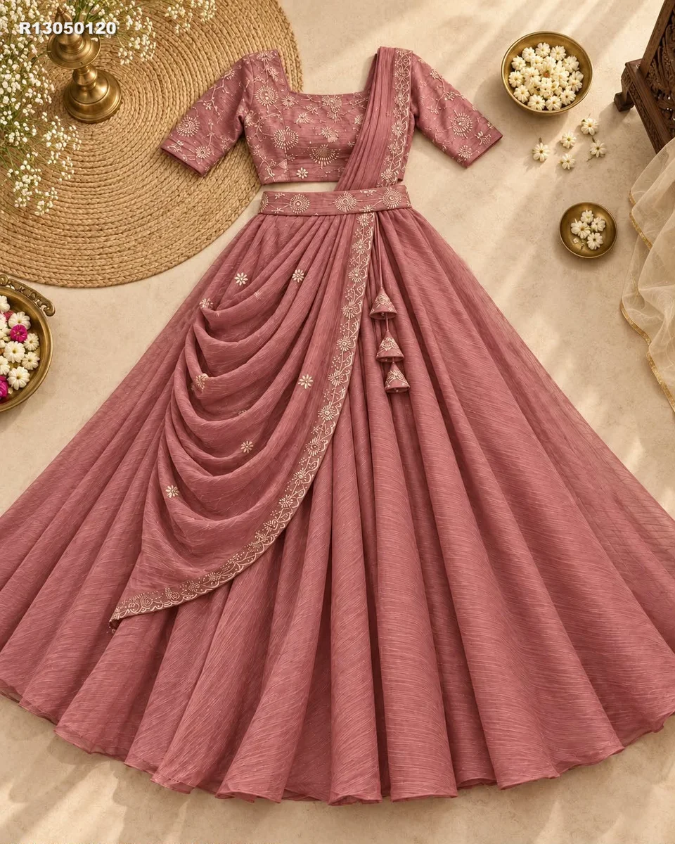 Rk ethinics.. Draped in dusty rose, this lehenga radiates refined glamour. Shimmering beadwork adds graceful sparkle to every movement. Flowing volume creates a regal 5