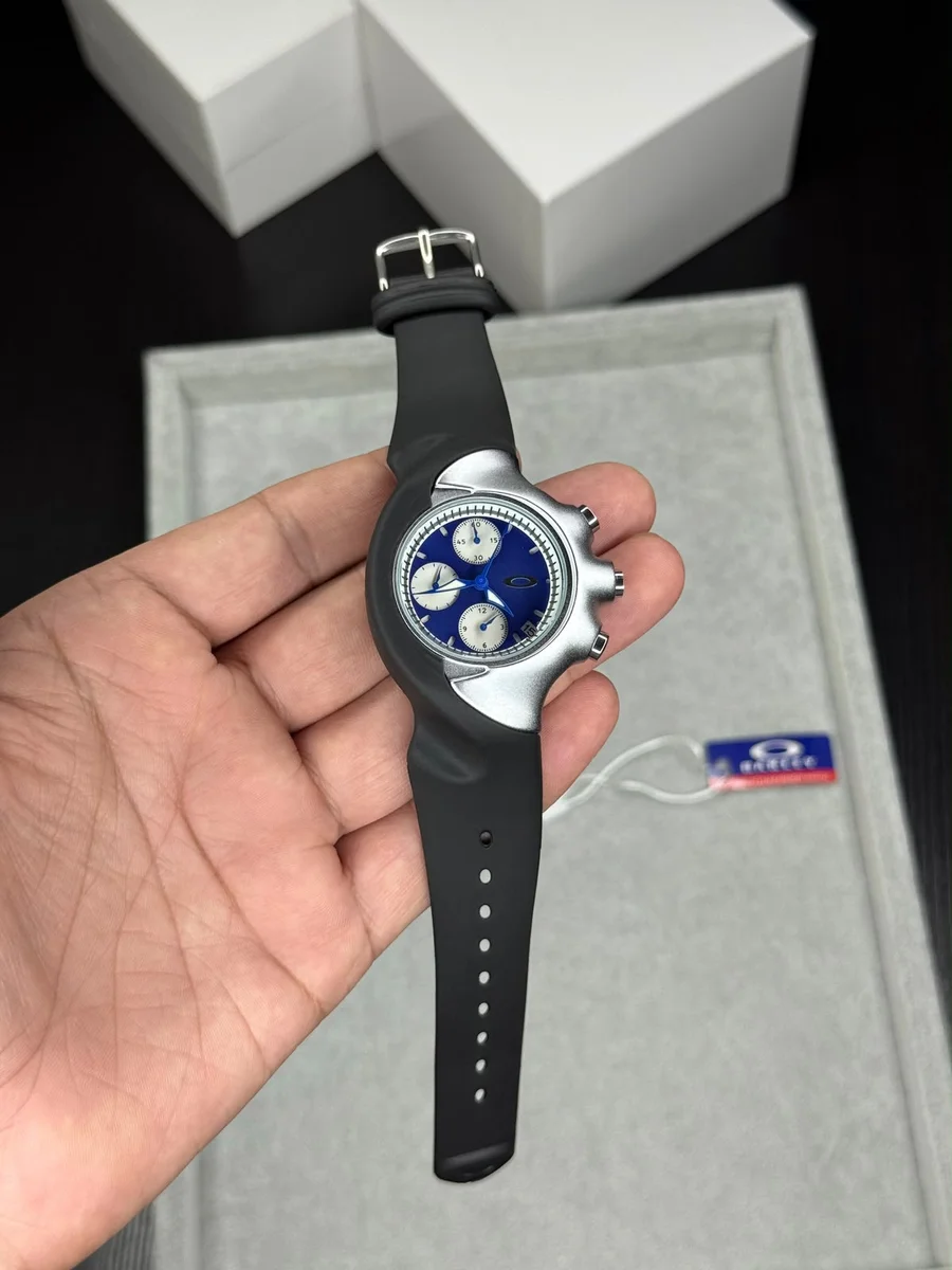 Oakley Detonator wristwatch featuring a silver bezel and black rubber strap. 2