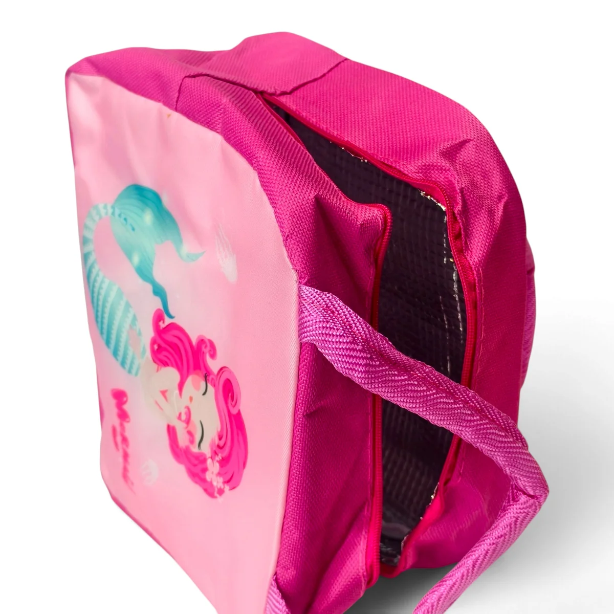 Shows the lunch bag being carried by a child, demonstrating its convenient size and kid-friendly design.