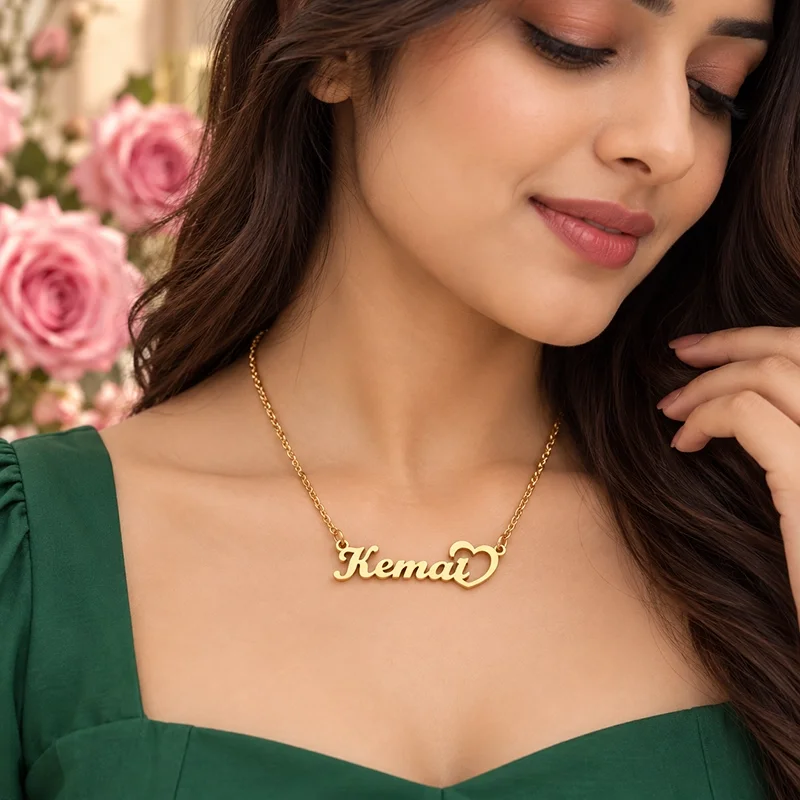 Woman wearing IGIFTZI Gold Plated Unique Heart Name Necklace with Kemal pendant and green dress.